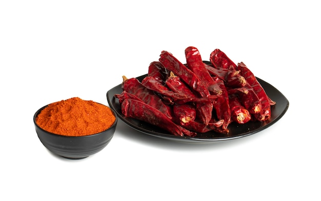 Dried Red Chili Peppers with Chili Powder on White Background