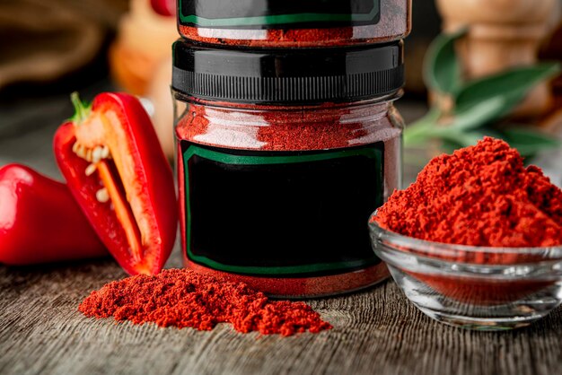 Dried red paprika poured into a box for sale Dried spices