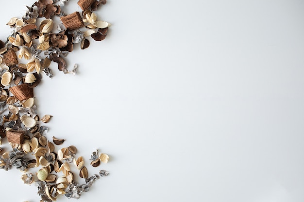 dried rose flowers on white background