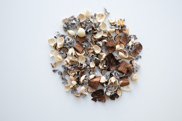 dried rose flowers on white background