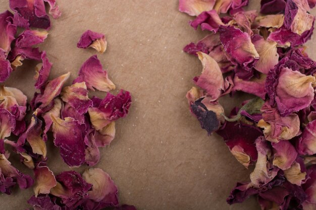 Dried rose petals in box and as a background