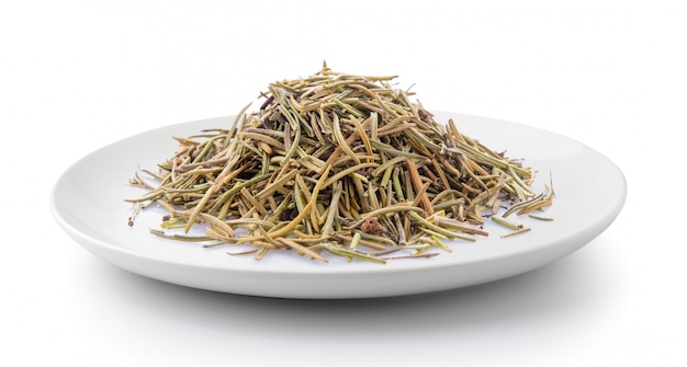 Dried rosemary leaves in a plate isolated