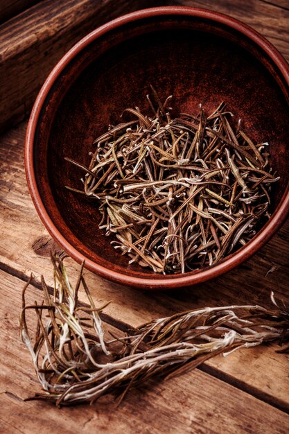 Dried rosemary on vintage background