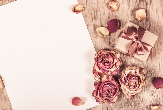 Dried roses and clean paper