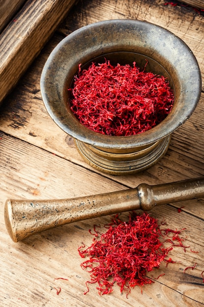 Dried saffron in mortar