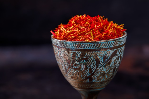 Dried saffron spice a glass of metal Oriental flavor