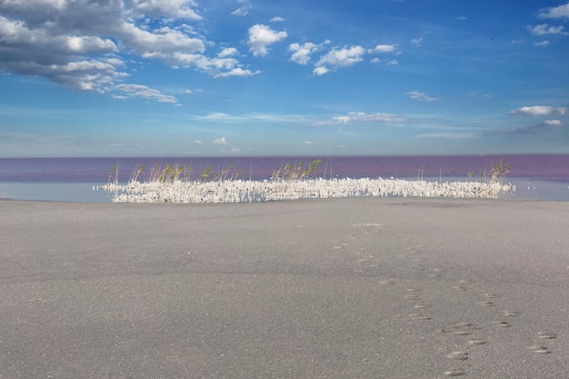 Dried salt lake layer of salt blue sky and clouds