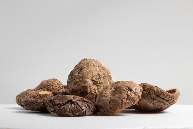 Dried shiitake mushrooms isolated on white background.