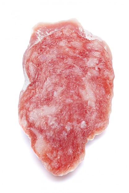 Dried sliced organic salami sausage on white isolated