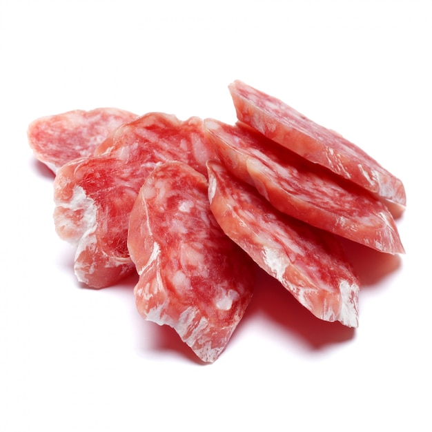 Dried sliced organic salami sausage on white isolated