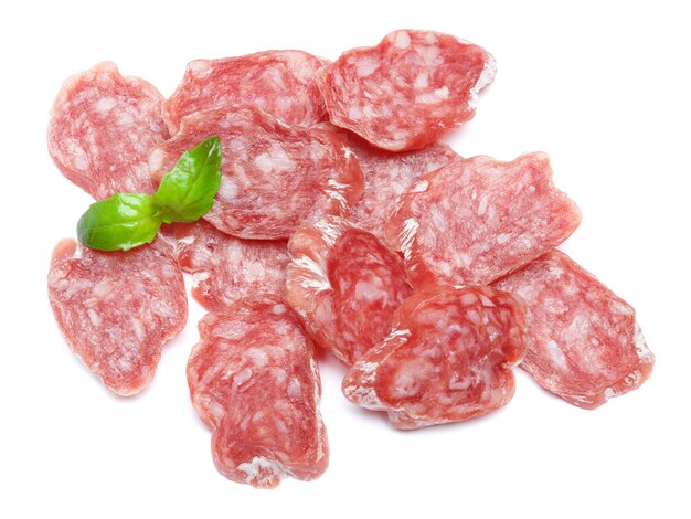 Dried sliced organic salami sausage on white isolated