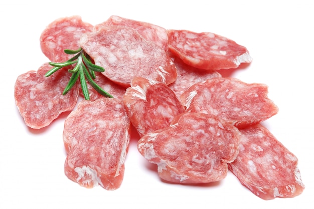 Dried sliced organic salami sausage on white isolated