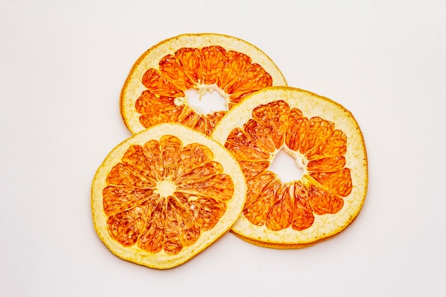 Dried slices of grapefruit isolated on white background