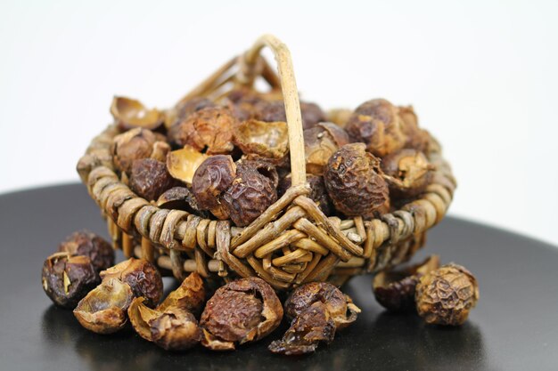 Dried soap nuts with black stone seeds