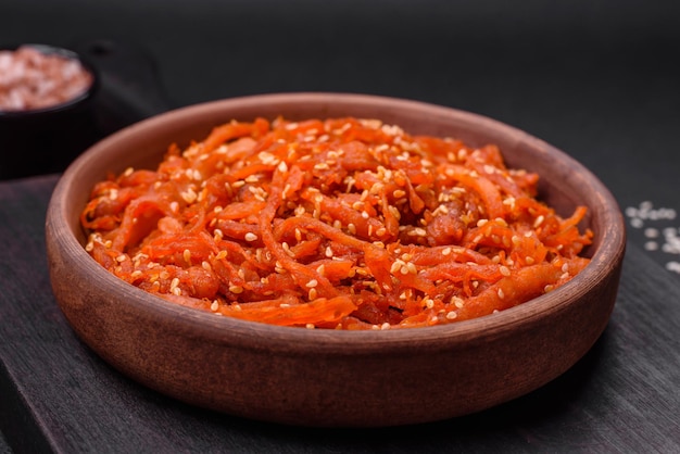 Dried squid chopped into slices and seasoned with sesame seeds and spices