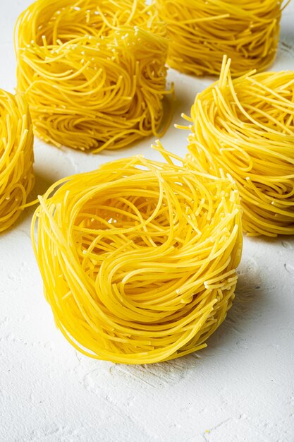 Dried taglierini on white stone