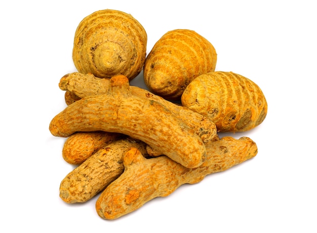 Dried turmeric over white background