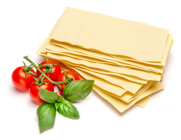 Dried uncooked lasagna pasta sheets and tomato