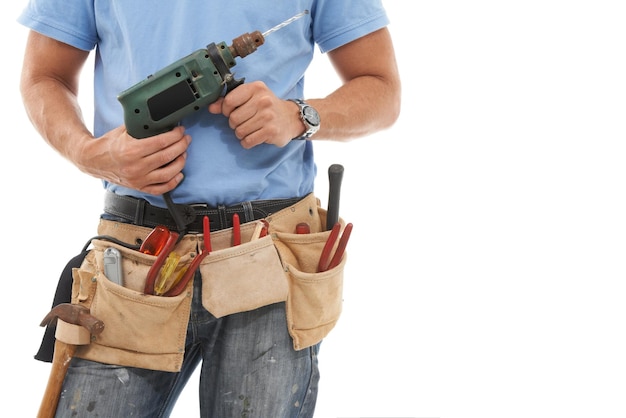 Drill construction and hands of man with tools belt for engineering maintenance and building Manual labor technician service and contractor builder and handyman with gear bag on white background