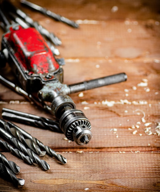 Drill with drills on the table