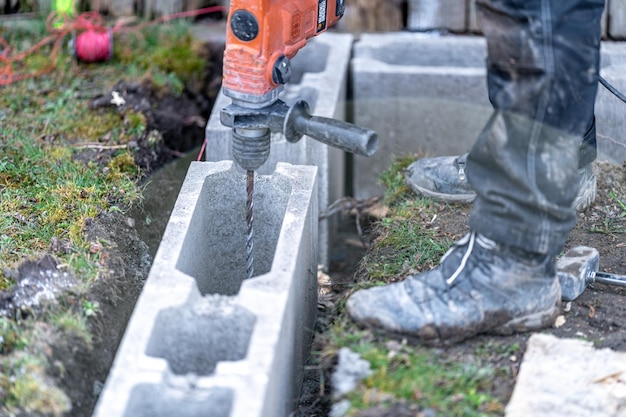 Drilling of concrete foundations with an electric drill