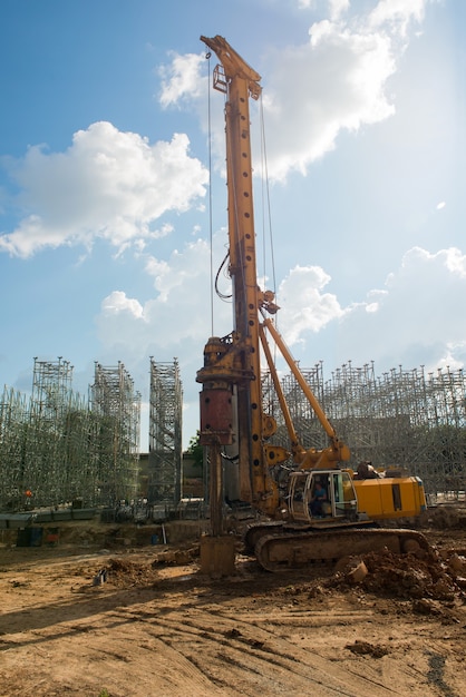 Drilling rig digs soil at a construction site