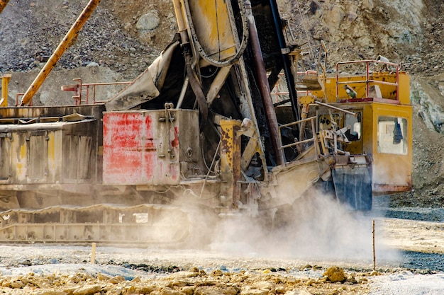 Drilling rig in open pit mine