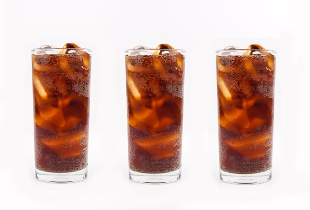 Drink cola with ice in glass on white background