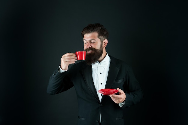 Drink to kickstart his morning Hipster drink coffee balck background Businessman enjoy drink break Hot drink Coffee time Good morning