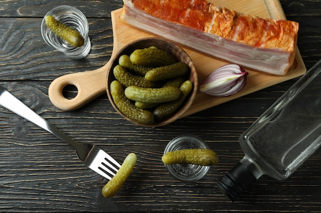 drink and tasty snacks on wooden table