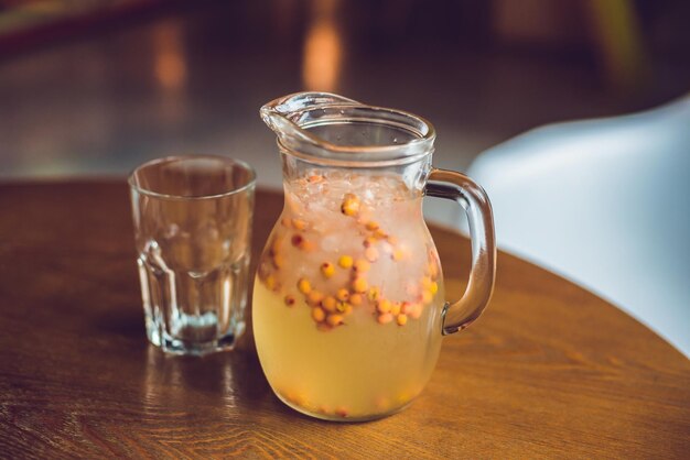 Drink with ginger and sea-buckthorn and with ice