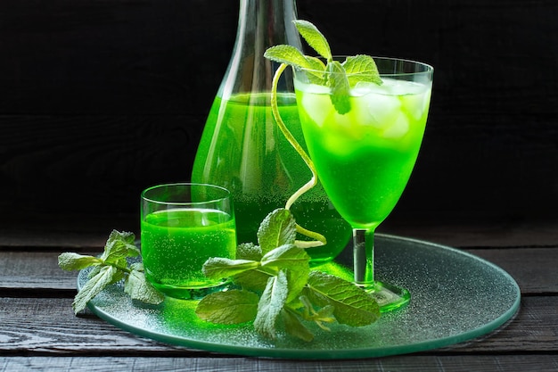 Drink with tarragon and mint cocktail with ice