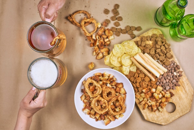 Drinking beer. Table full of beer snacks