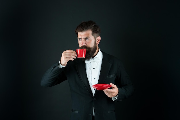 Drinking coffee Businessman enjoy coffee break Relax concept Preparing caffeine beverage using coffee machine Cafe equipment shop Serving perfect espresso Man bearded hipster drinking coffee