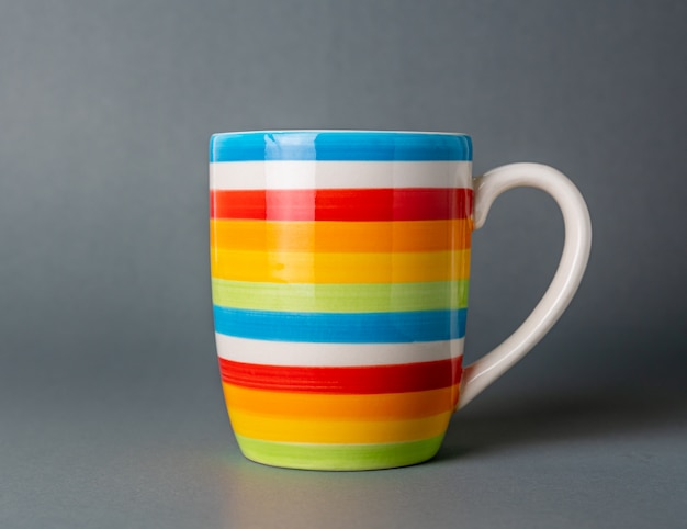 Drinking cup multicolor color, Gray background