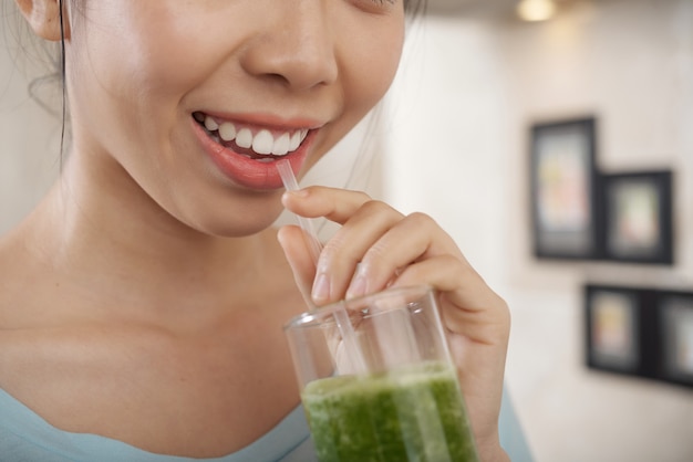 Drinking Green Smoothie Through Straw