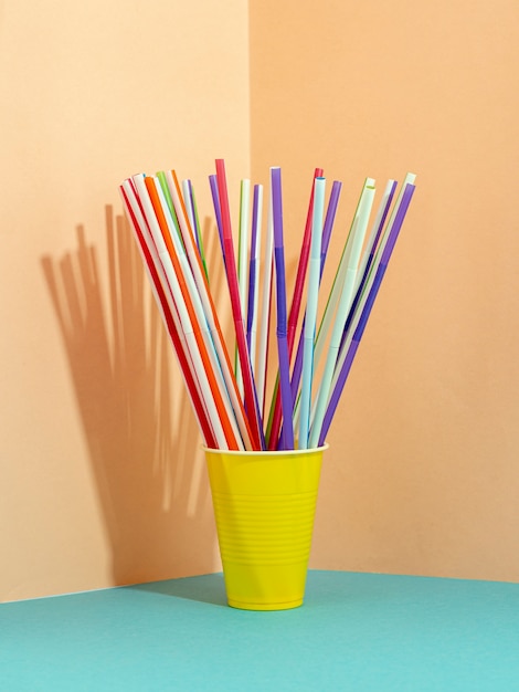 Drinking straws on colorful background