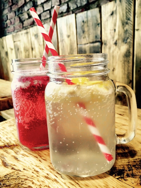 Photo drinks in jar on wooden table