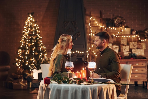 Drinks wine Young lovely couple have romantic dinner indoors together