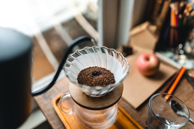 Photo drip coffee in house,pouring a hot water over a drip coffee