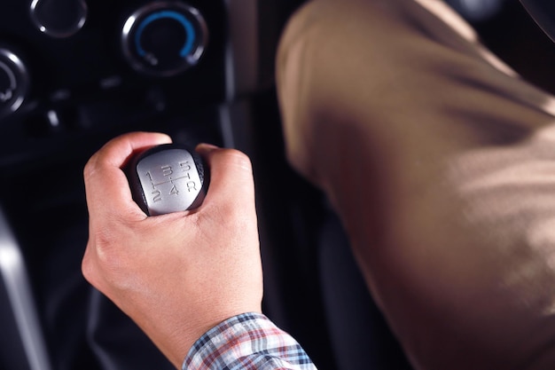 Photo the driver changes gears with a manual gear lever