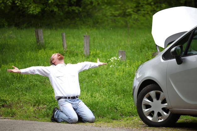 Photo driver furious a broken car by the road