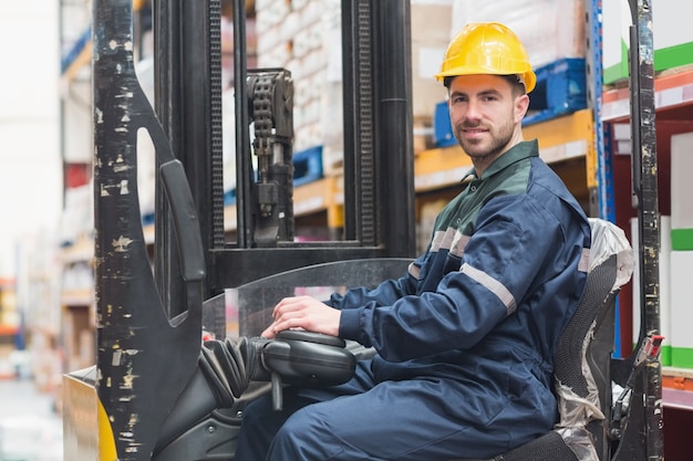 Photo driver operating forklift machine in warehouse