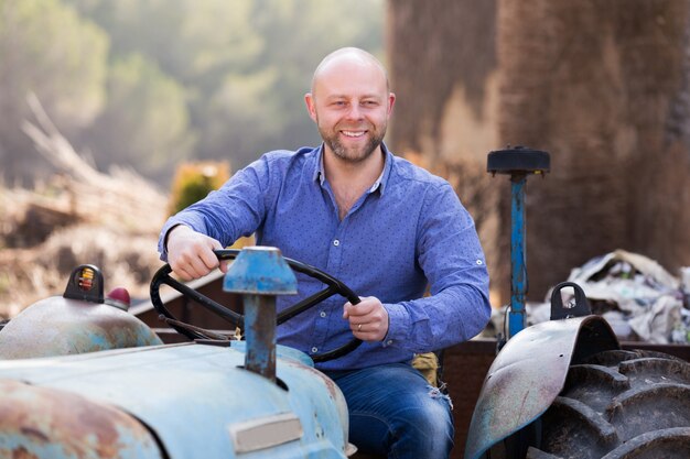 Driver working with tractor