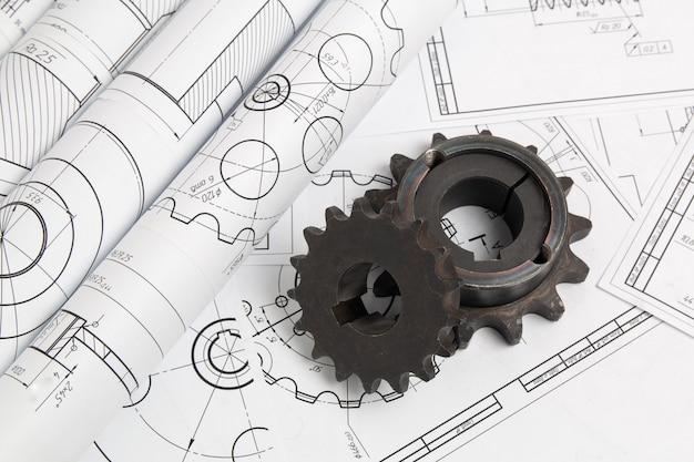 Driving sprockets and engineering drawings of industrial parts and mechanisms