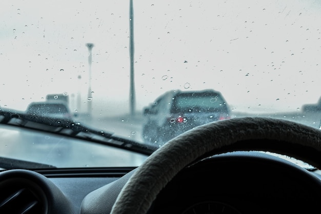 Photo driving through road in rainy season