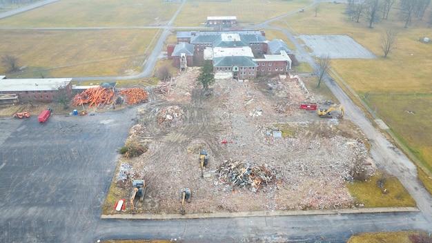 Drone aerial of large abandoned building being destroyed and demolished nearly completed