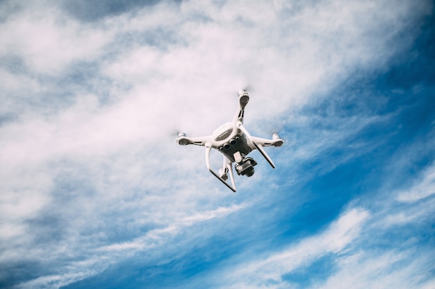 Drone flying over the blue sky