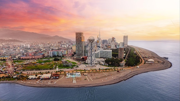 Photo drone photo of coast batumi city at pink sunset