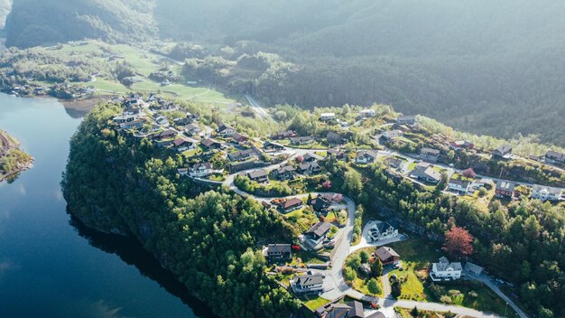 drone photo Norwegian village on the shore of the fjord at the foot of the mountains